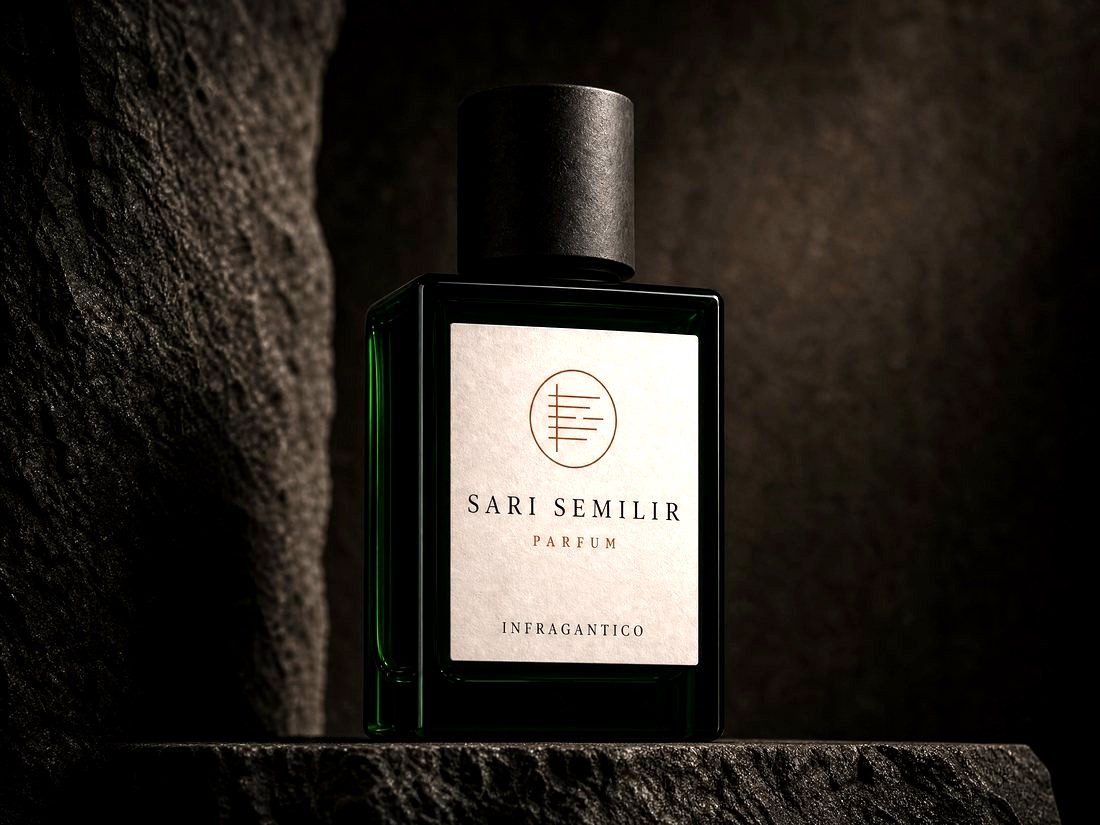 Sari Semilir — dark green glass bottle with bone label and the Infragantico seal, on black stone