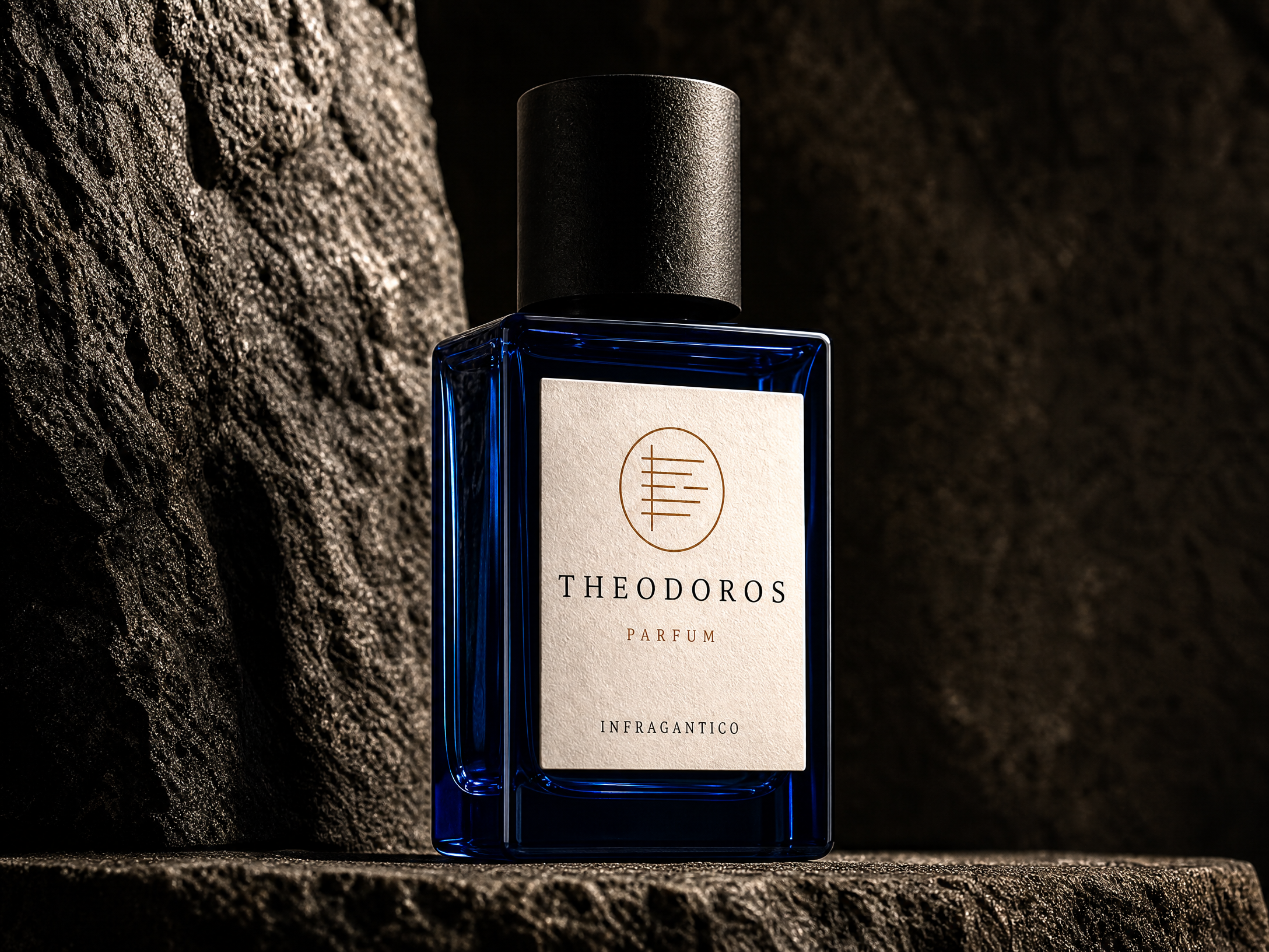 Theodoros — deep navy glass bottle with bone label and the Infragantico seal, on dark stone